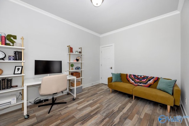 office area featuring wood finished floors, ornamental molding, and baseboards