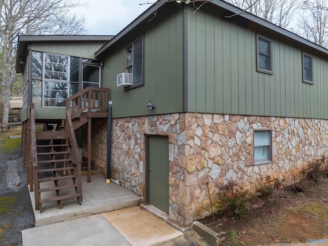back of house featuring cooling unit