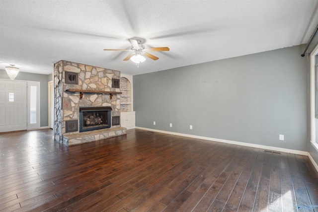 unfurnished living room featuring hardwood / wood-style flooring, ceiling fan, a textured ceiling, and a fireplace