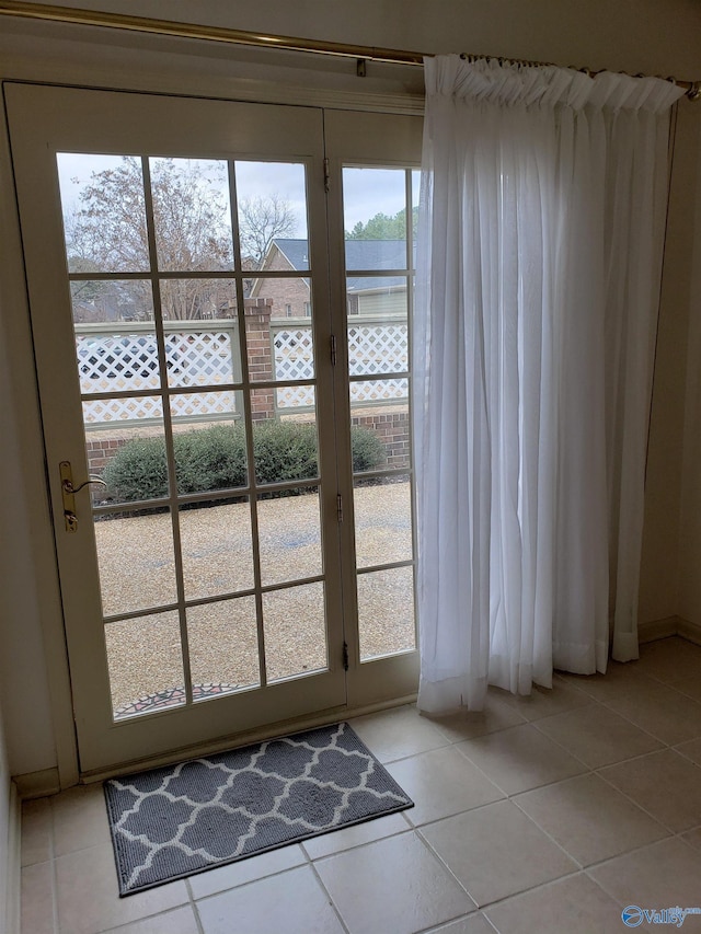 entryway featuring light tile patterned floors