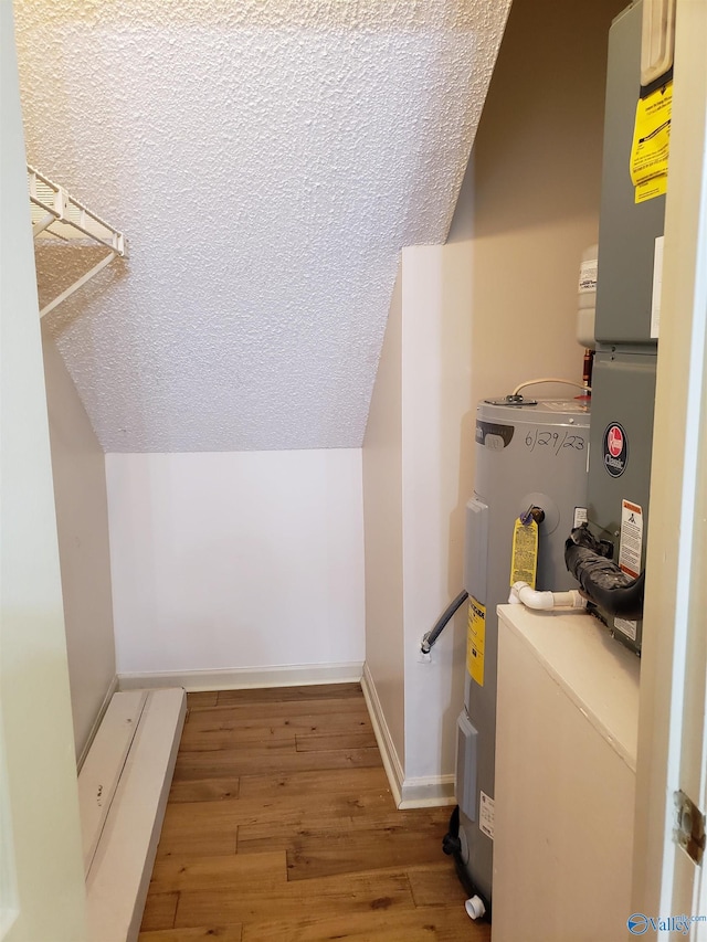 utility room featuring electric water heater