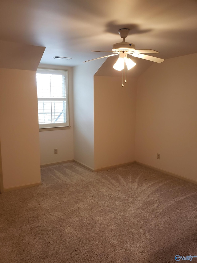 additional living space featuring ceiling fan and carpet floors