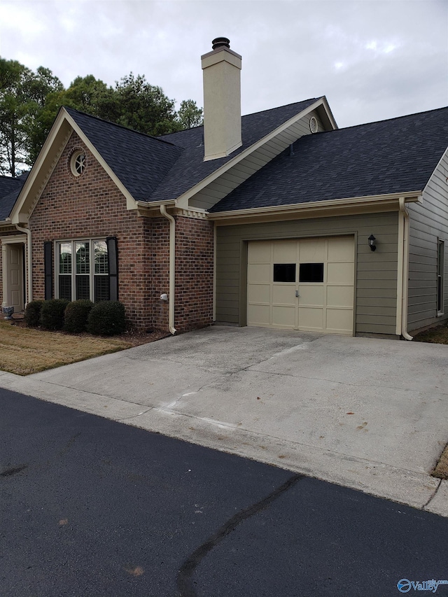 ranch-style house featuring a garage