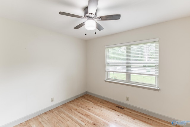 1108 Danmann Dr SE, Huntsville, AL 35803 - empty room featuring light wood-type flooring, baseboards, and a ceiling fan