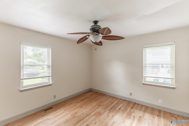 1108 Danmann Dr SE, Huntsville, AL 35803 - empty room featuring baseboards, light wood-style floors, and a ceiling fan