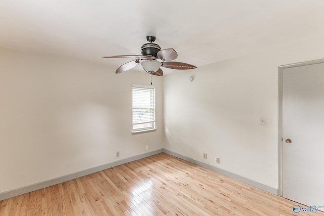 1108 Danmann Dr SE, Huntsville, AL 35803 - spare room featuring ceiling fan, light wood-style flooring, and baseboards