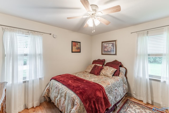 1108 Danmann Dr SE, Huntsville, AL 35803 - bedroom featuring wood finished floors, multiple windows, and a ceiling fan