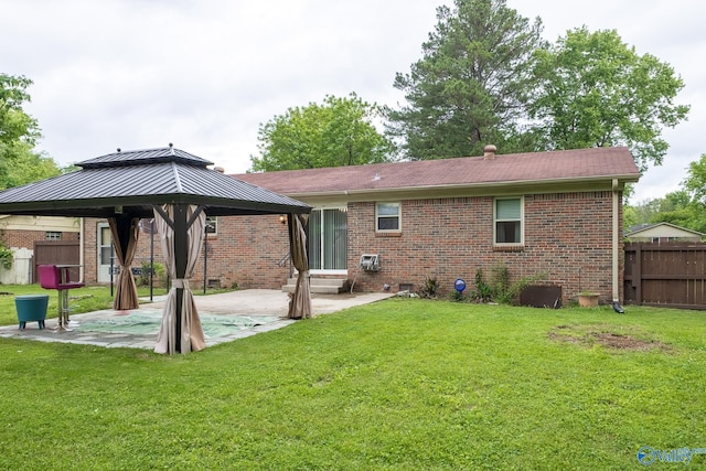 1108 Danmann Dr SE, Huntsville, AL 35803 - rear view of house with a gazebo, a patio, and brick siding