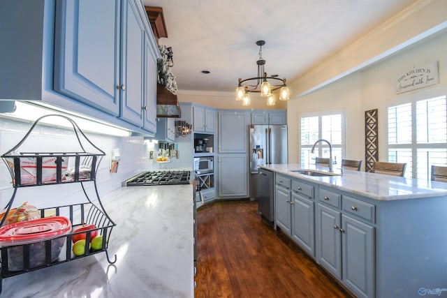 kitchen featuring pendant lighting, crown molding, sink, dark hardwood / wood-style flooring, and stainless steel appliances