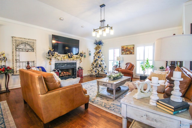 living room featuring a high end fireplace, dark hardwood / wood-style floors, and crown molding