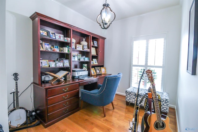 office area featuring light hardwood / wood-style flooring and ornamental molding