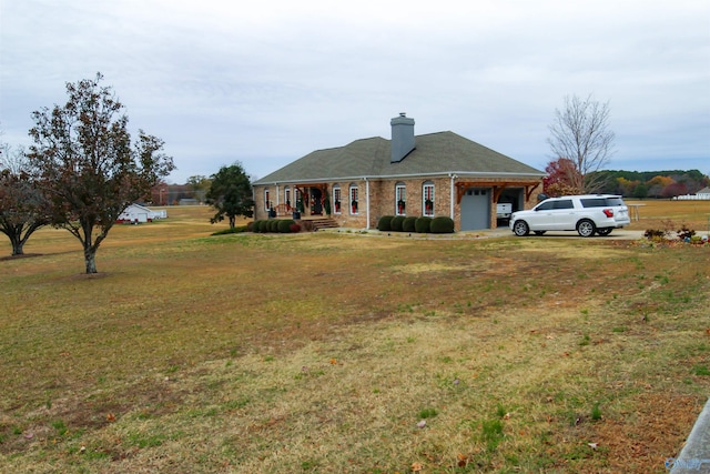 single story home with a front yard and a garage