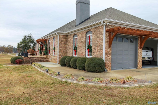 view of side of home with a garage and a yard