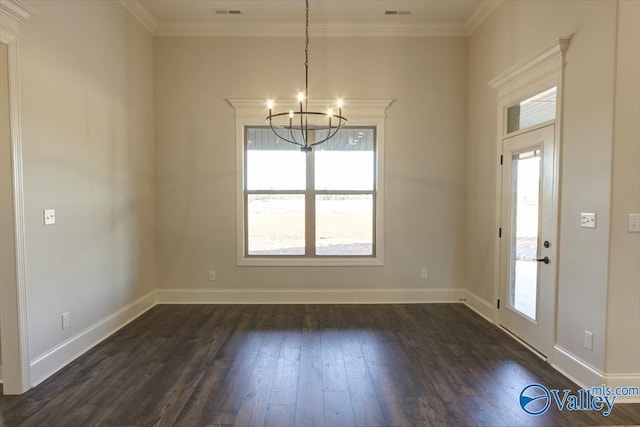 interior space with an inviting chandelier, ornamental molding, a wealth of natural light, and dark hardwood / wood-style flooring