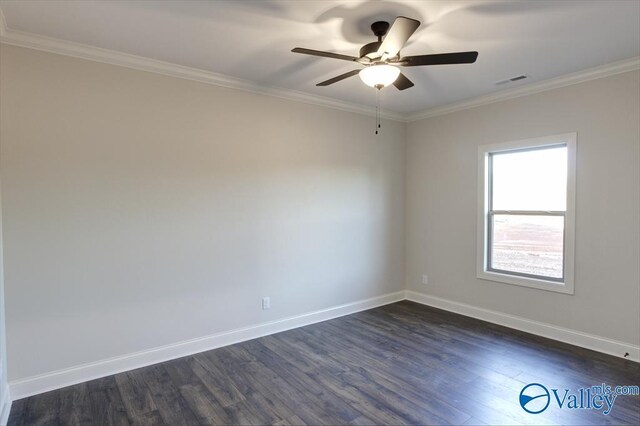 empty room with ceiling fan, ornamental molding, and dark hardwood / wood-style floors