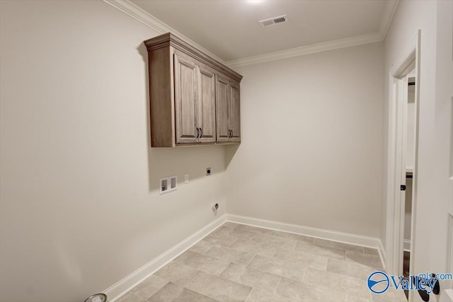 washroom with cabinets, crown molding, washer hookup, and hookup for an electric dryer