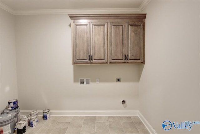 washroom featuring electric dryer hookup, hookup for a washing machine, ornamental molding, and cabinets