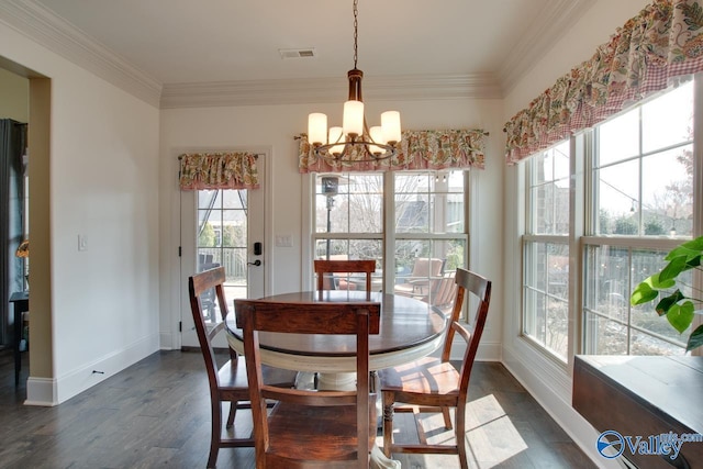 dining space featuring ornamental molding, dark wood-type flooring, a chandelier, and visible vents