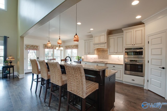 kitchen with appliances with stainless steel finishes, dark wood finished floors, backsplash, and ornamental molding