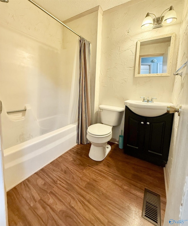 full bathroom featuring shower / tub combo, vanity, toilet, and hardwood / wood-style floors