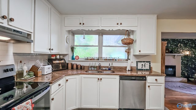 kitchen with white cabinets, sink, and appliances with stainless steel finishes