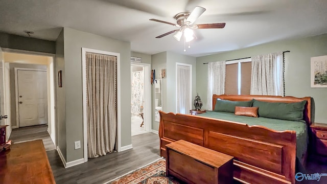 bedroom featuring ceiling fan, dark hardwood / wood-style floors, and ensuite bathroom