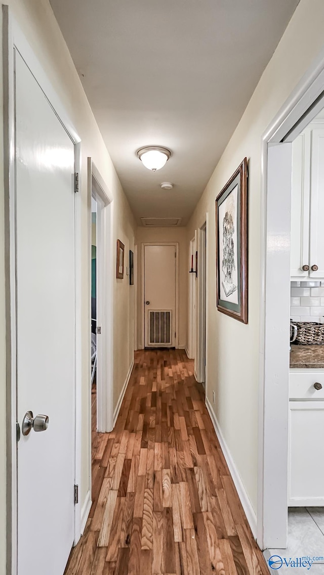 hall with light wood-type flooring