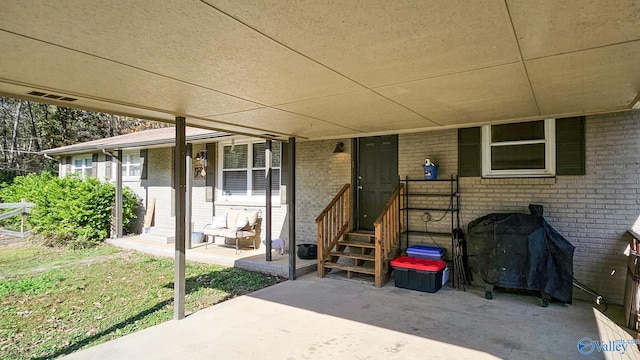 doorway to property featuring a patio area