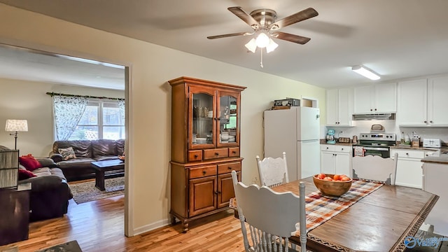 dining room featuring ceiling fan and light wood-type flooring