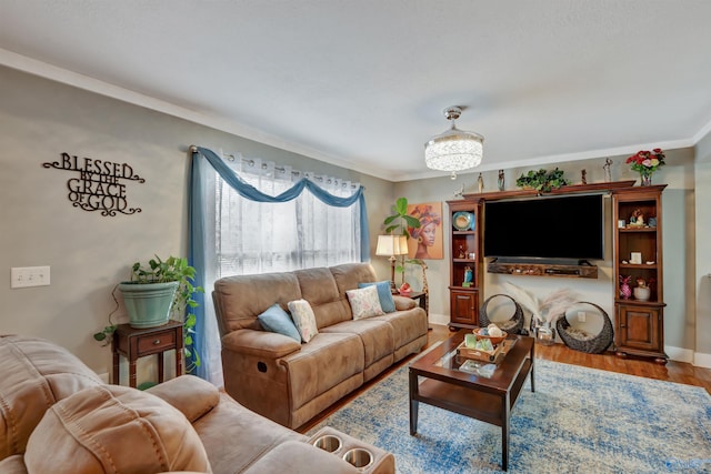 living room with ornamental molding and hardwood / wood-style floors