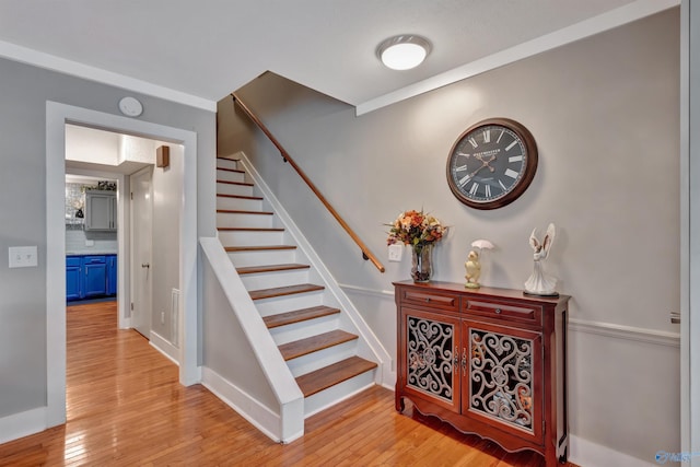 stairway with hardwood / wood-style flooring