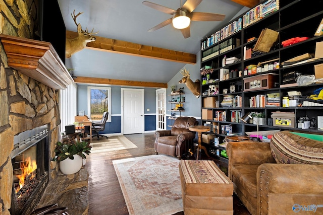 sitting room featuring wood-type flooring, a ceiling fan, lofted ceiling, and a fireplace