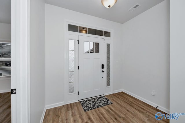 entrance foyer with hardwood / wood-style floors