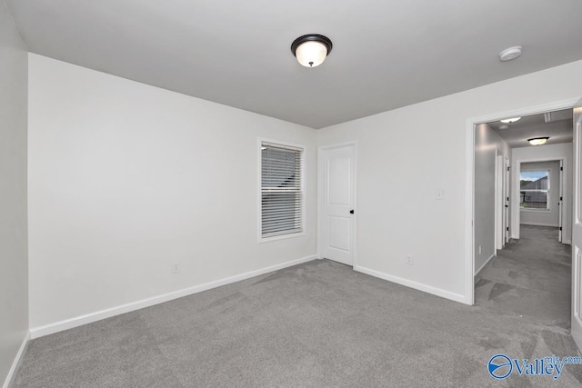 unfurnished room with carpet floors