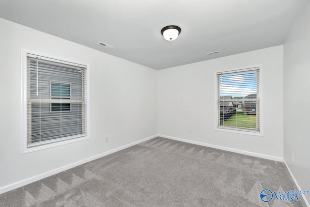 empty room featuring carpet flooring