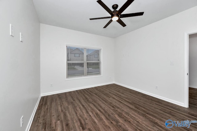 unfurnished room featuring ceiling fan and dark wood-type flooring