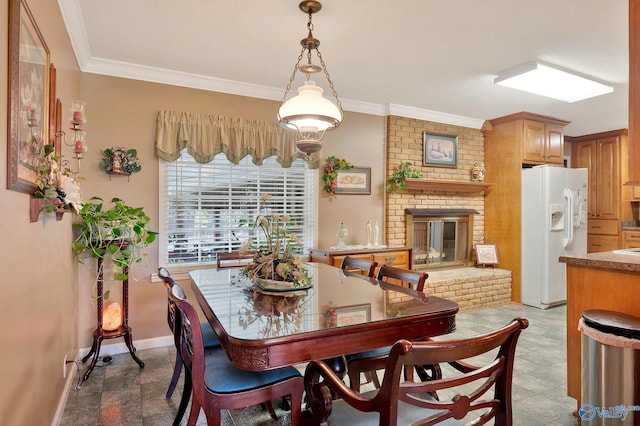 dining room featuring brick wall, ornamental molding, a brick fireplace, and tile patterned flooring