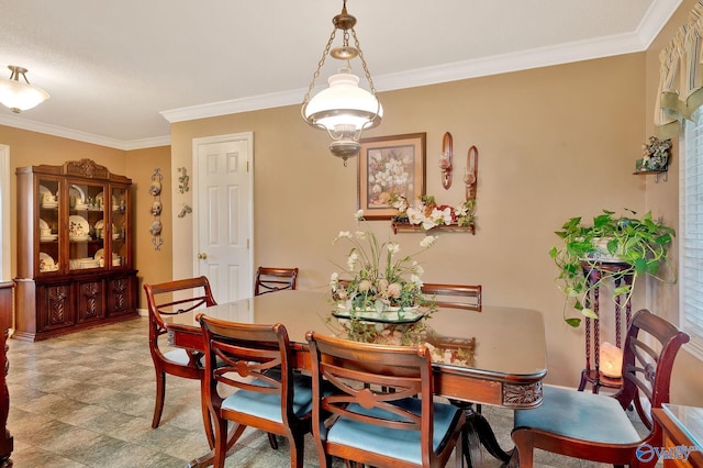 tiled dining room with ornamental molding