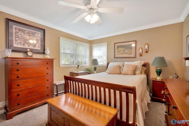 bedroom featuring carpet floors, crown molding, and ceiling fan