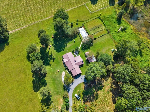birds eye view of property with a rural view