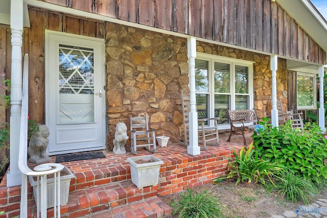 entrance to property with a porch
