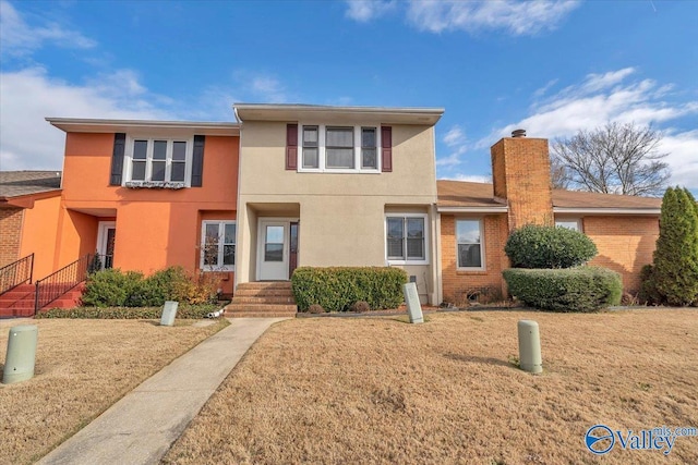 view of front facade with a front yard