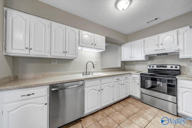 kitchen featuring stainless steel appliances, white cabinetry, and sink