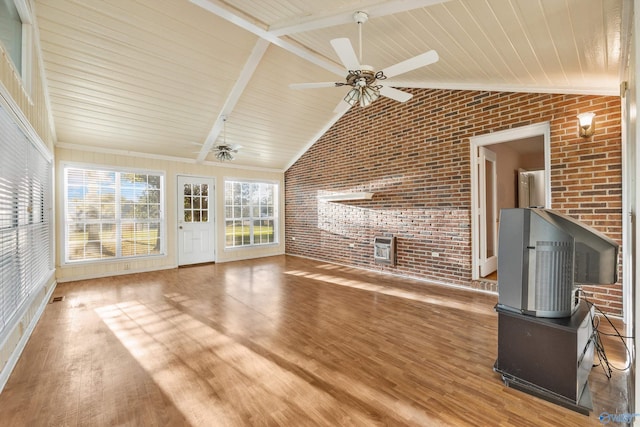 unfurnished living room featuring wood-type flooring, brick wall, beam ceiling, and ceiling fan