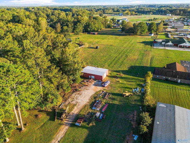 birds eye view of property with a rural view