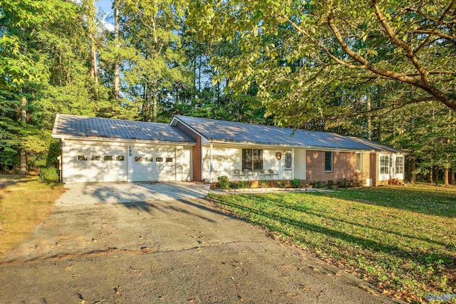 ranch-style home with a front yard and a garage