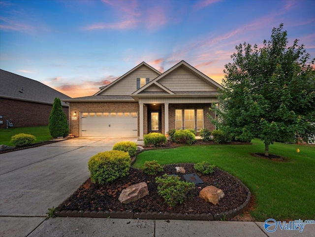 9054 Segers Trail Loop NW, Madison, AL 35756 - view of front of home with a garage, concrete driveway, a front lawn, and brick siding