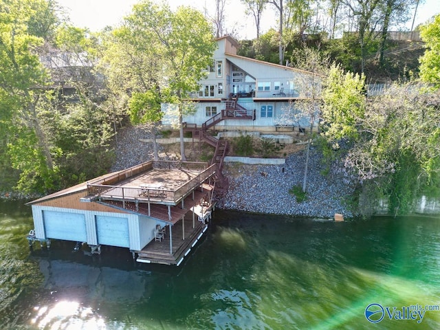 dock area featuring a deck with water view