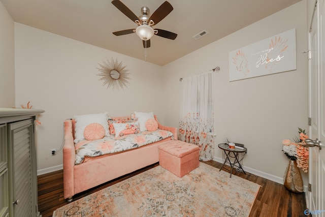 bedroom with dark wood-type flooring and ceiling fan