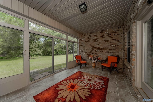 sunroom featuring wood ceiling